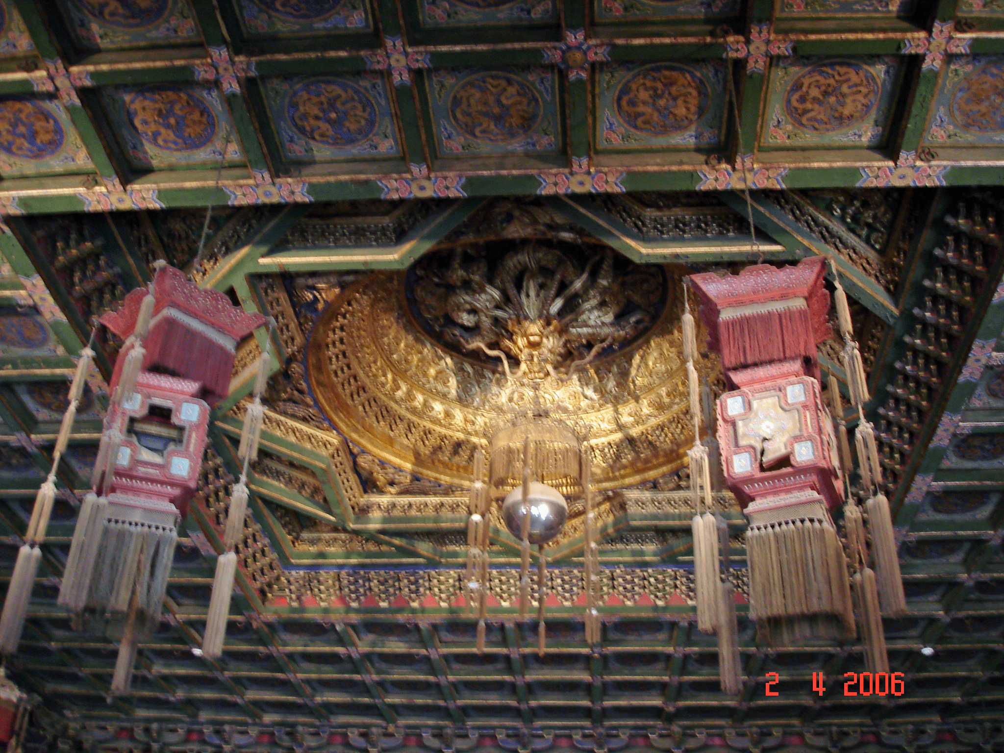 A caission of golden dragons above the throne in the Emperors Throne room.