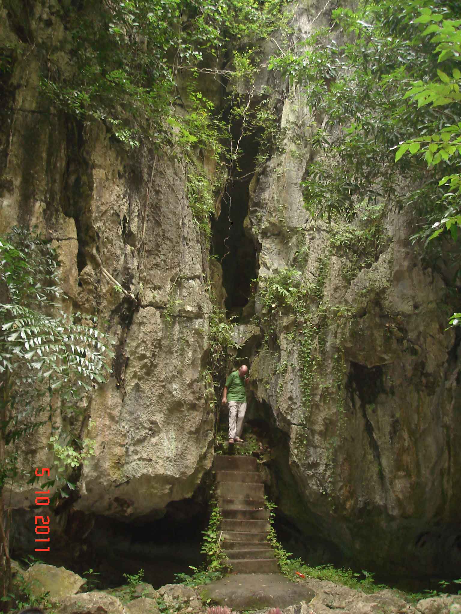 Kampot - Steps leading into high caverns - Kampong Trach