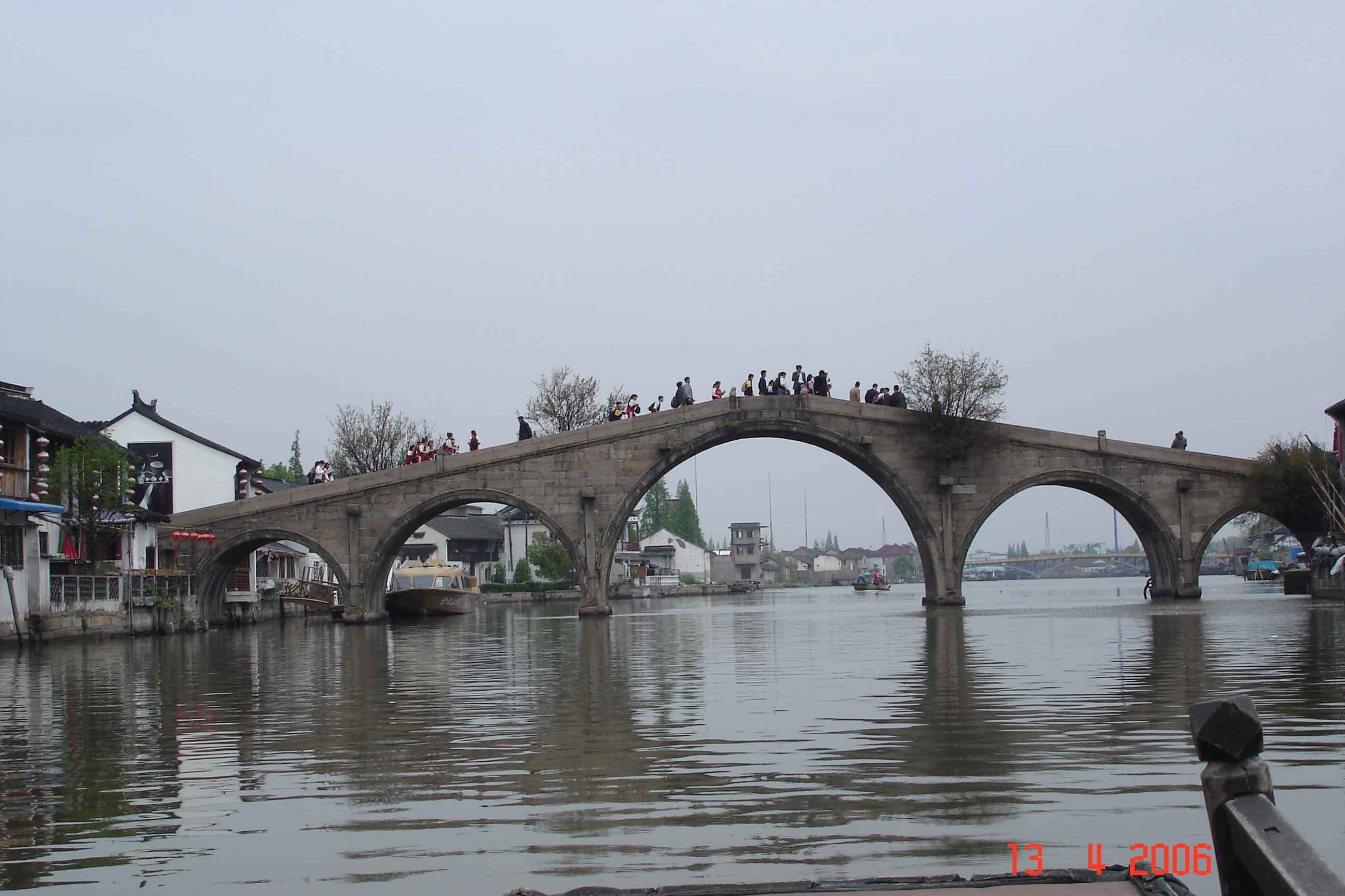 Feng Shang Bridge-School children crossing Zhujiajiao water town
