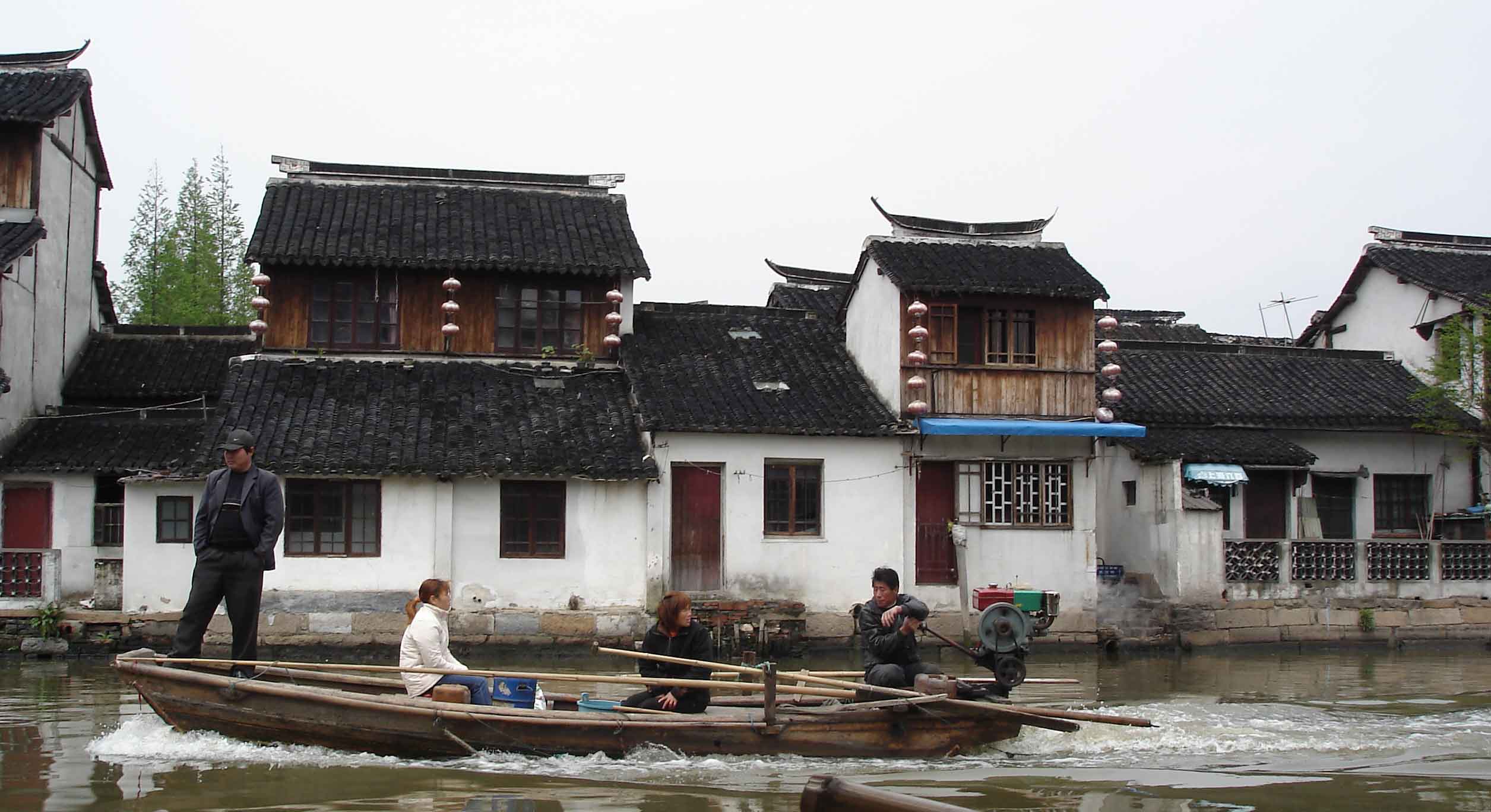 Motor Boat disrupts the tranquil canal scene-ancient Water Town-Zhujiajiao