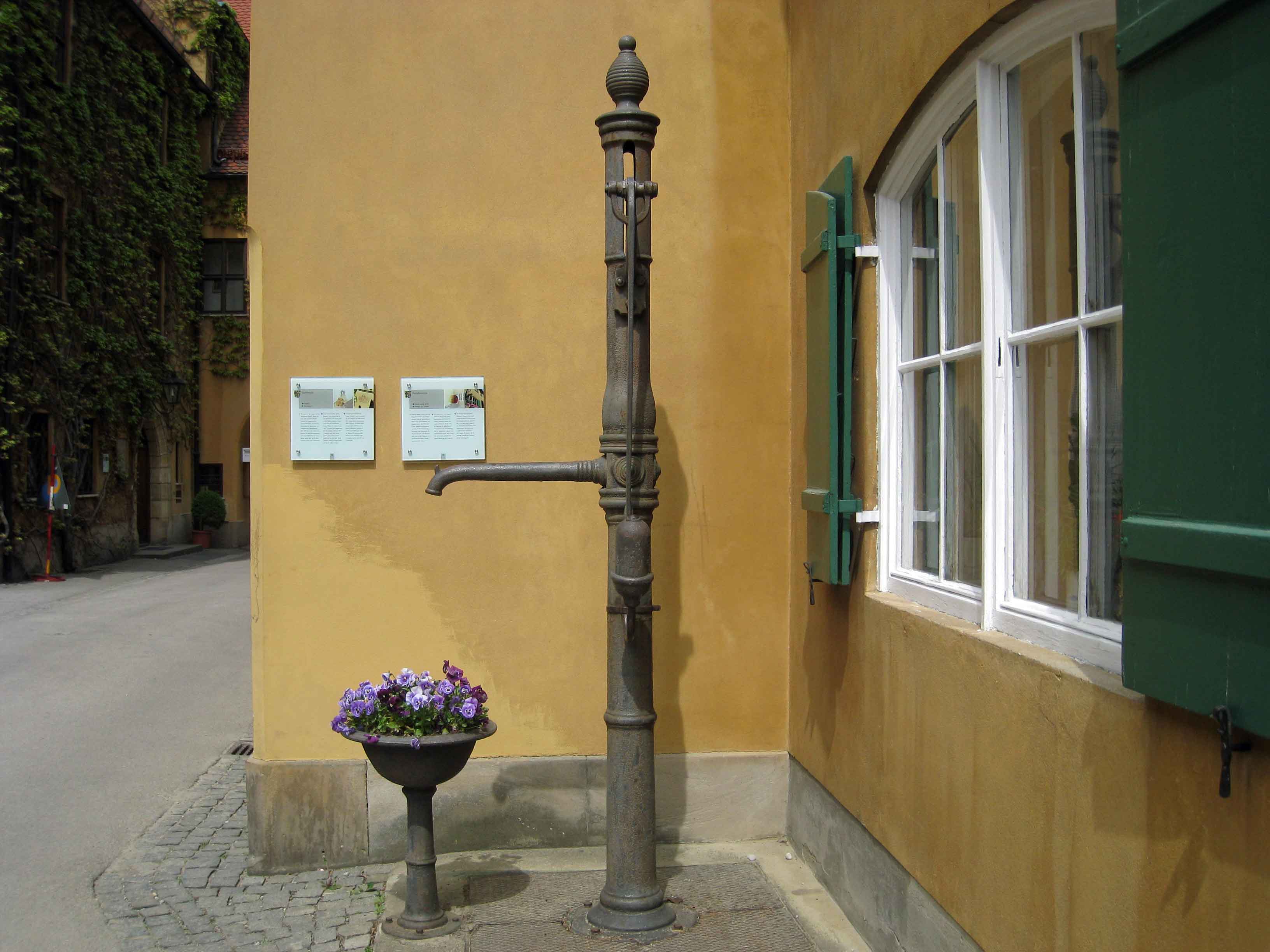 Old cast iron basin fountain installed in 1744 - Fuggerei Village-Augsburg.