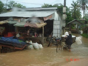 Barrow Man Rain cycling in rain Siem Riep