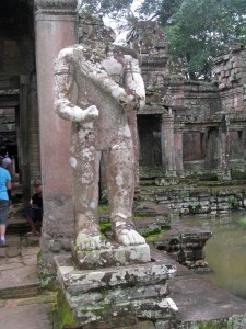 One of the two dvarapala guardian statues survives, though it is decapitated.